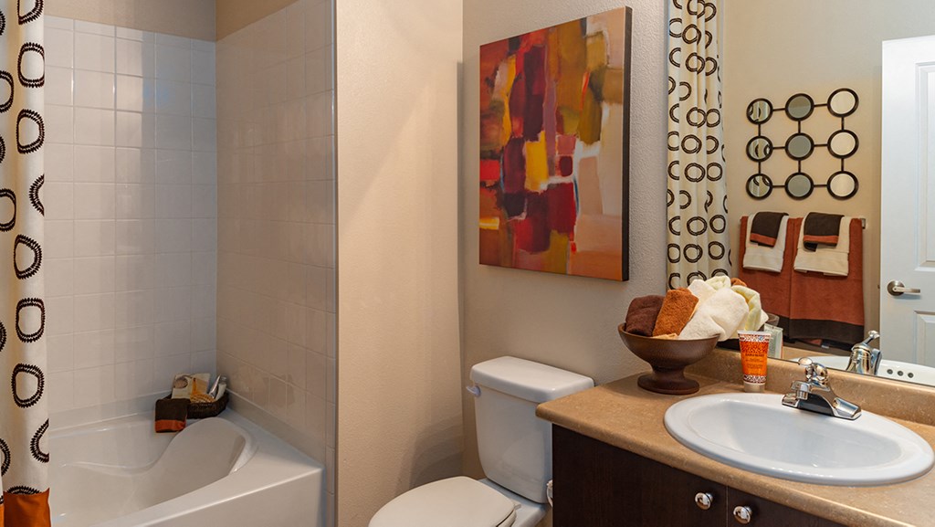 a bathroom with a sink toilet and bathtub