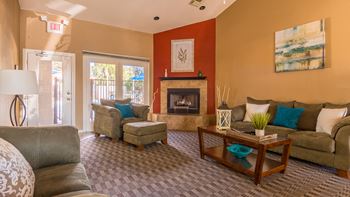 Estancia clubhouse with cozy couches and fireplace