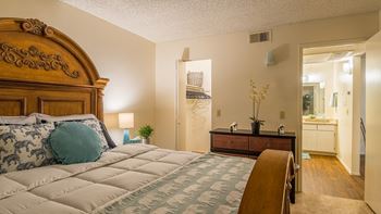 Riverstone spacious bedroom with large bed, and nice lighting