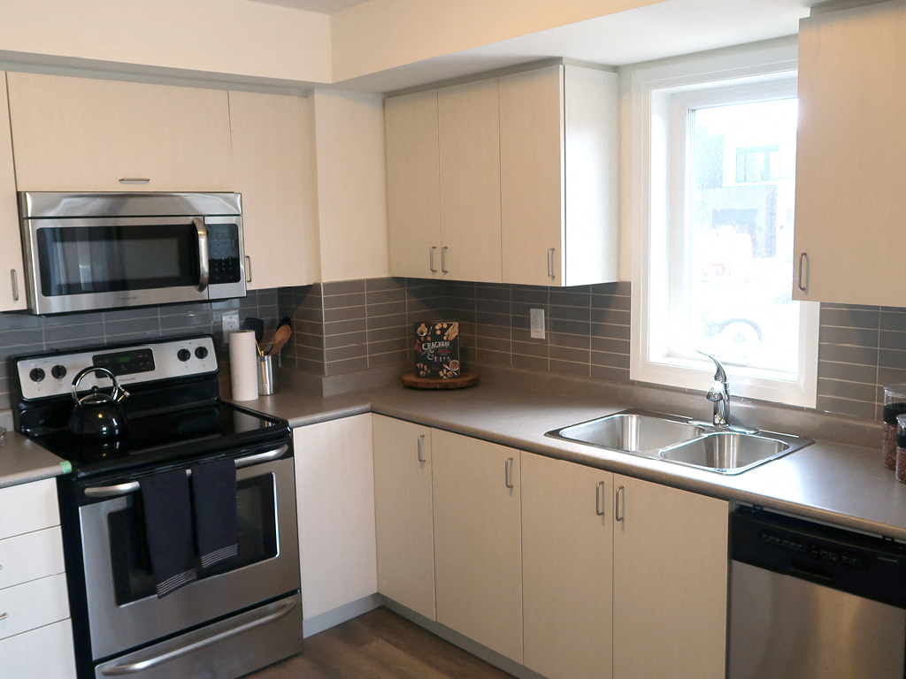 Kitchen with Stainless Steel Appliances and White Cabinets
