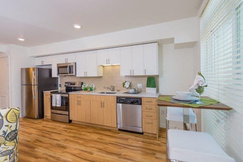 a kitchen with a sink and a refrigerator