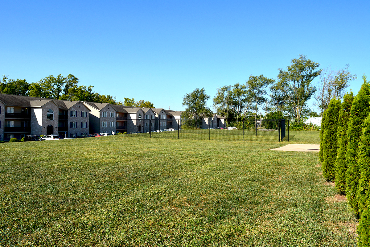 Dog park located next to apartment buildings