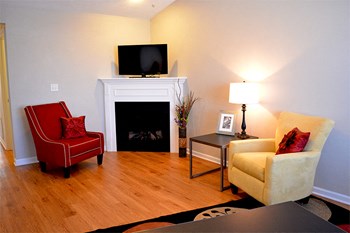 Living room with chairs next to fireplace - Photo Gallery 4