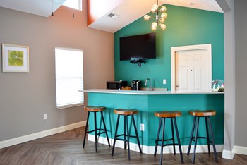 Clubhouse kitchen with counter height bar stool seating - Photo Gallery 11