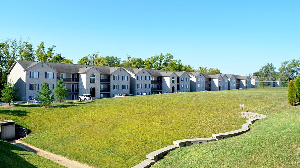 Exterior of apartment buildings and grassy field