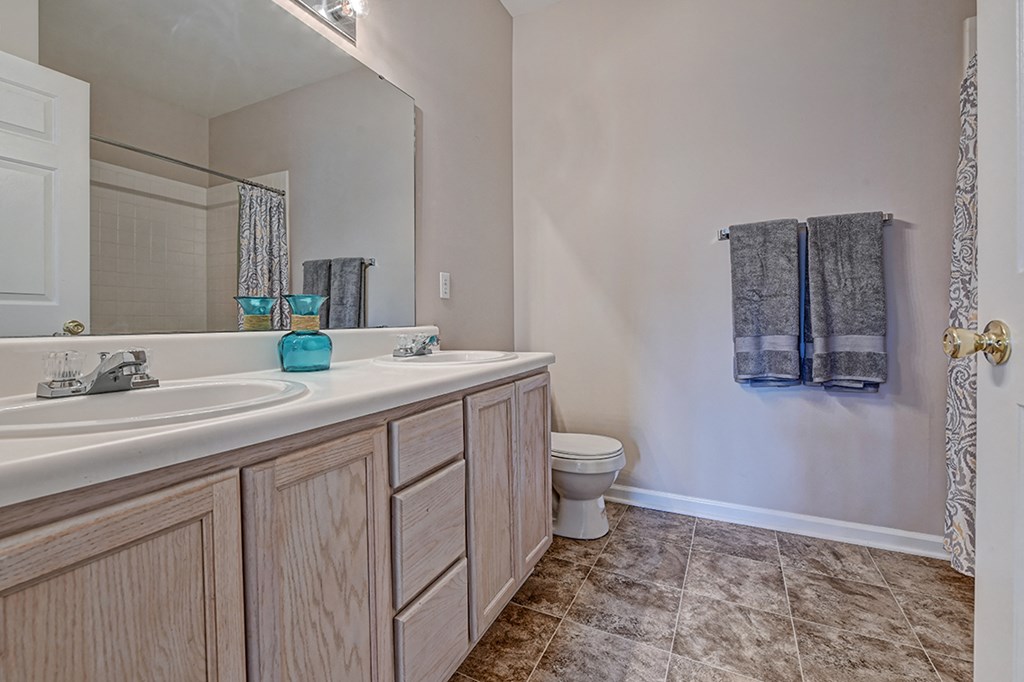 an empty bathroom with a toilet and a sink