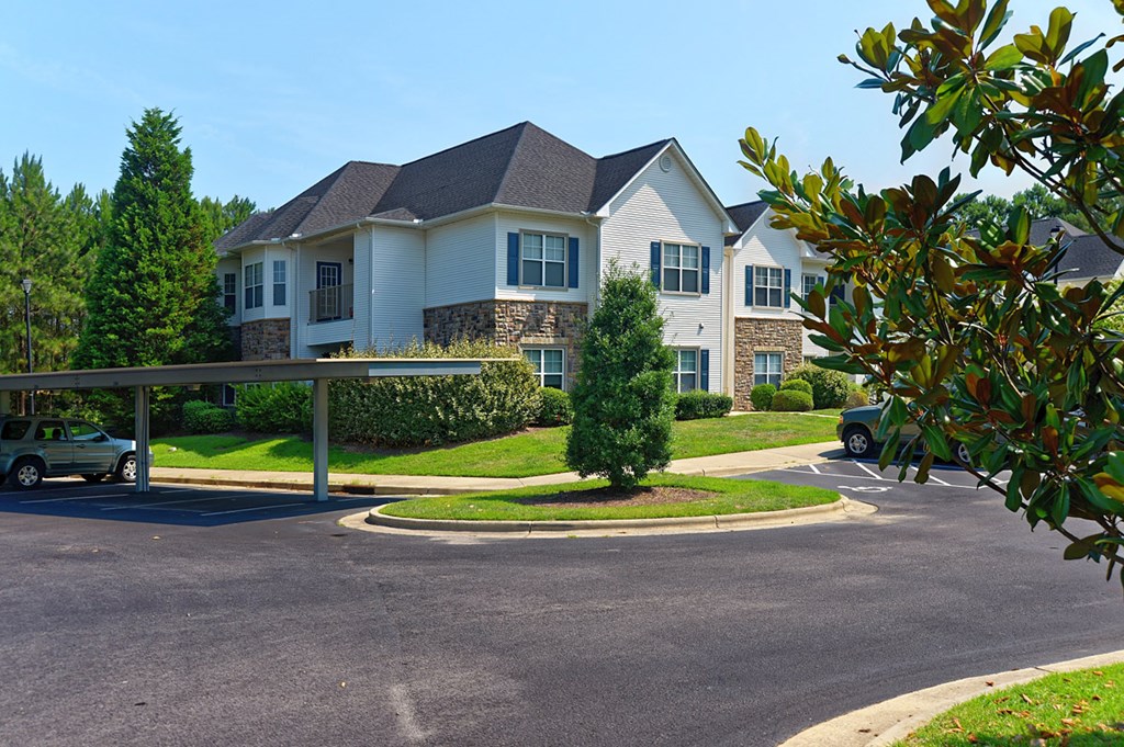 a large house on the corner of a parking lot