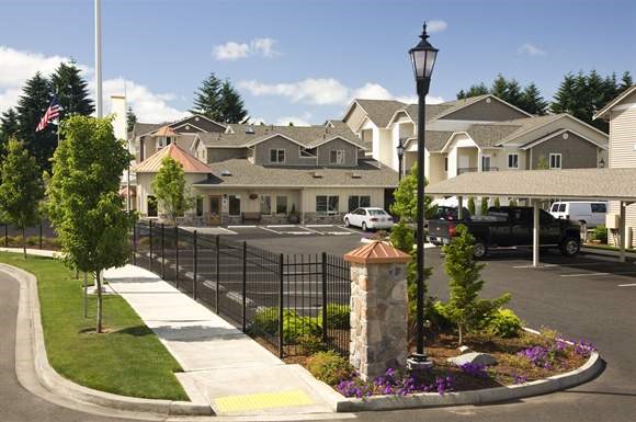 a street with houses and a parking lot