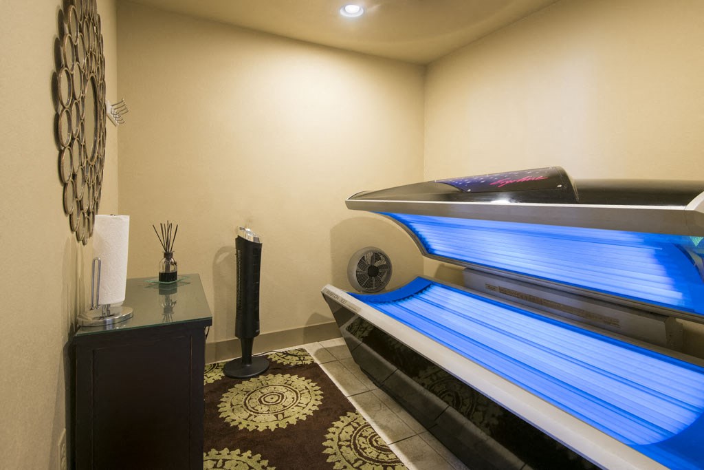 a spa room with a massage bed and a pool