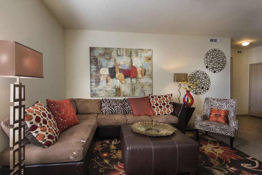 a living room with a brown leather couch