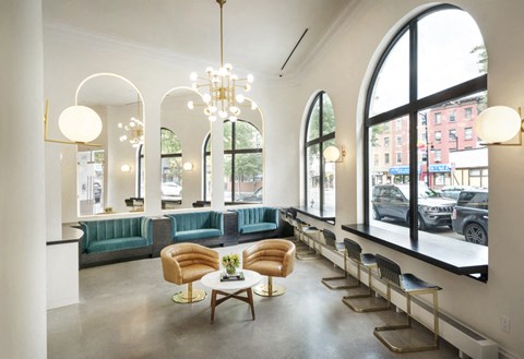 A large room with a long table and chairs.