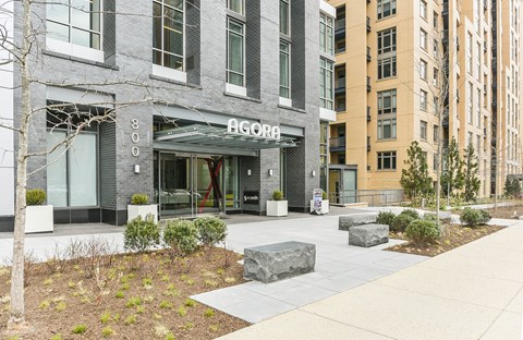 A modern building with the word "AGORA" on the front.