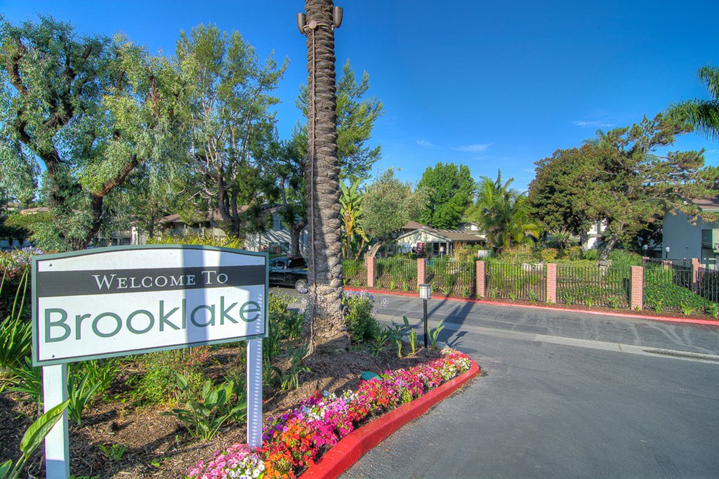 the welcome to brookok sign at the entrance e apartments