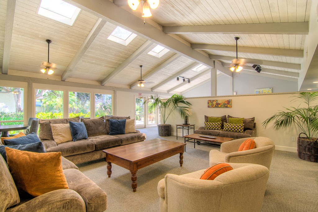 a living room with couches and chairs and a coffee table
