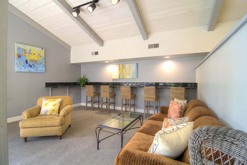 a living room with a bar and a couch