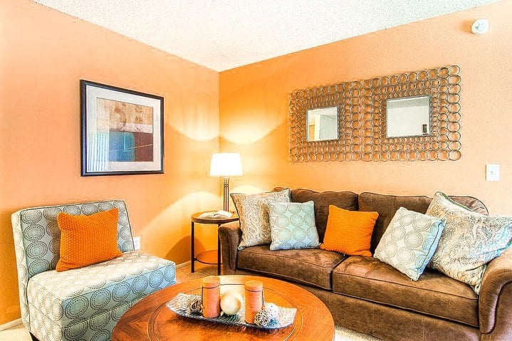 a living room with a couch and a table