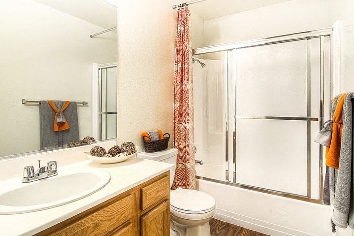 a bathroom with a sink toilet and a shower