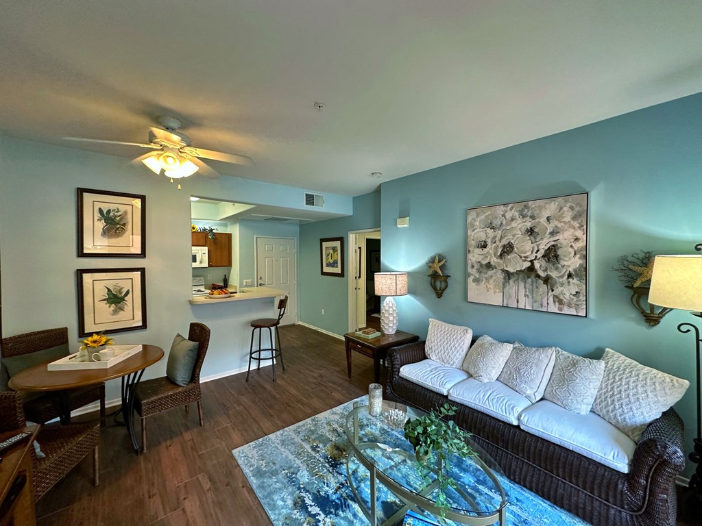 a living room with blue walls and a couch and a table
