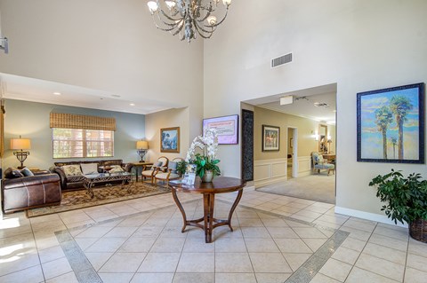 a living room with couches and a table