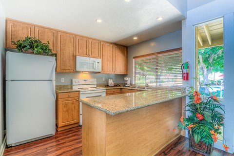 a kitchen with a counter top and a refrigerator