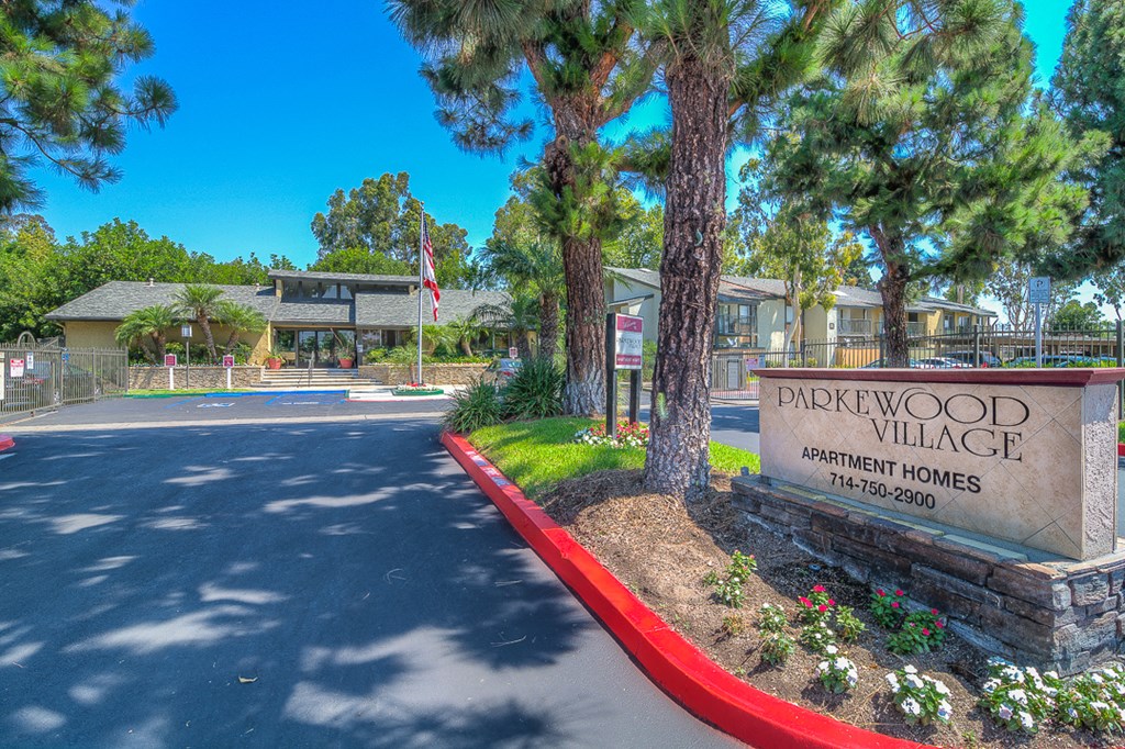 the welcome sign to dickwood village at the entrance of the street