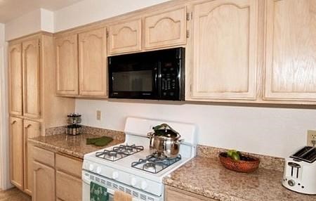 a kitchen with a stove and a microwave