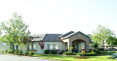 a house with a driveway and a street in front of it