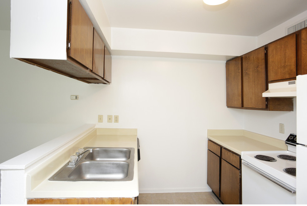 a kitchen with a sink and a stove and
