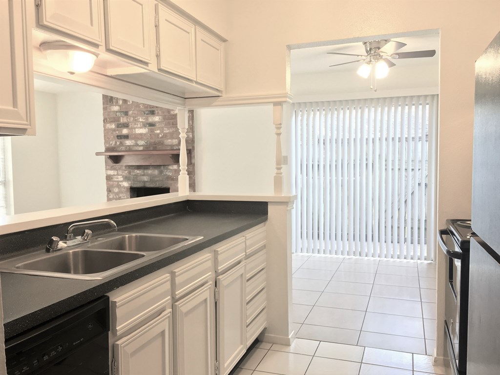 a kitchen with a sink and a window