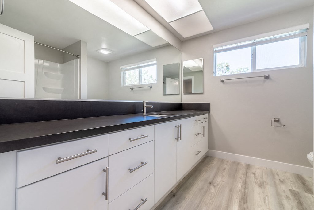 Renovated Bathrooms With Quartz Counters at Bixby Hill Apartments, California