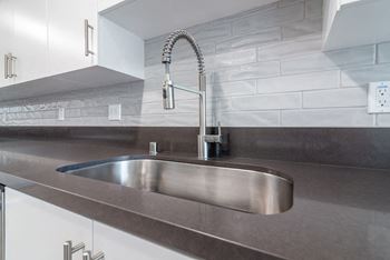 Stainless Steel Sink With Faucet In Kitchen at Bixby Hill Apartments, Long Beach, CA