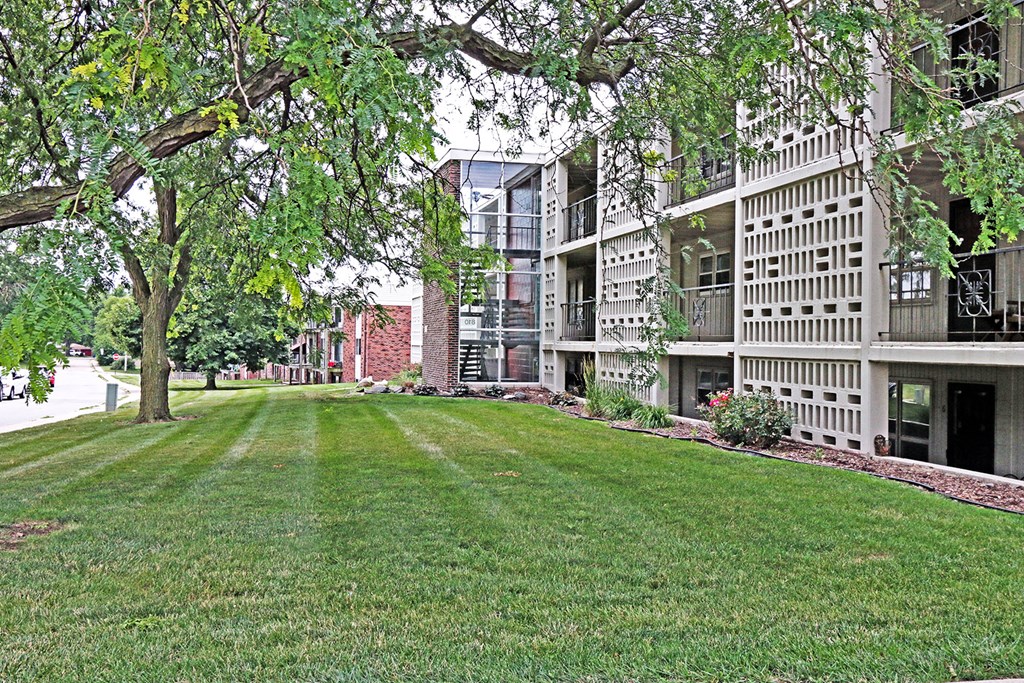 a large lawn in the middle of an apartment building