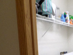 a laundry room with two washers and a dryer