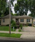 a house on the side of the street in a neighborhood