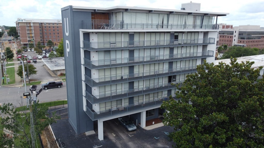 an aerial view of an apartment building in a city