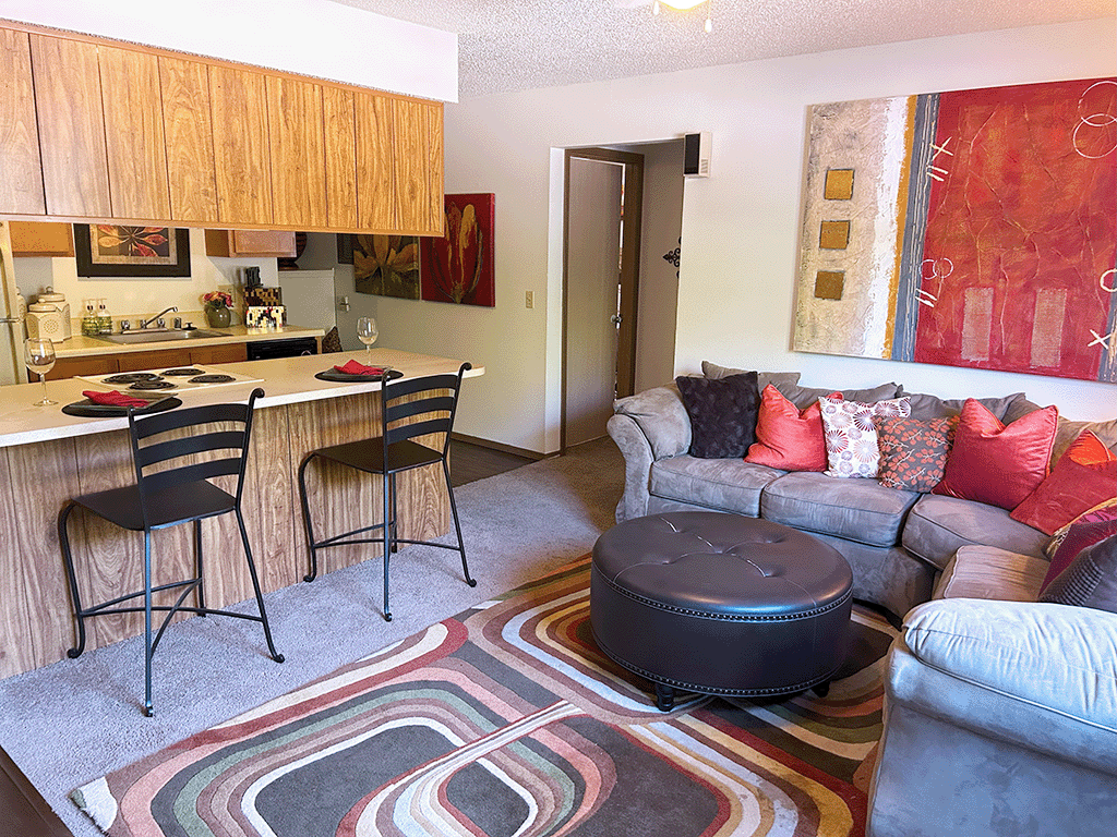 a living room with a couch and a table