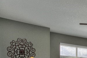 Village on Redwood bedroom with large windows and ceiling fan