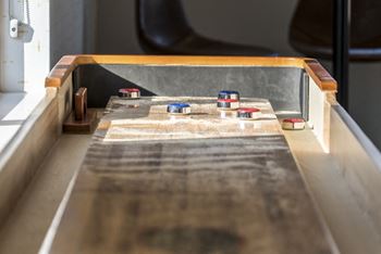 Shuffle board in the game room in the clubhouse at The Villas at Mahoney Park in Northeast Lincoln, Nebraska