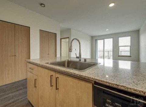 a kitchen with a sink and a counter top