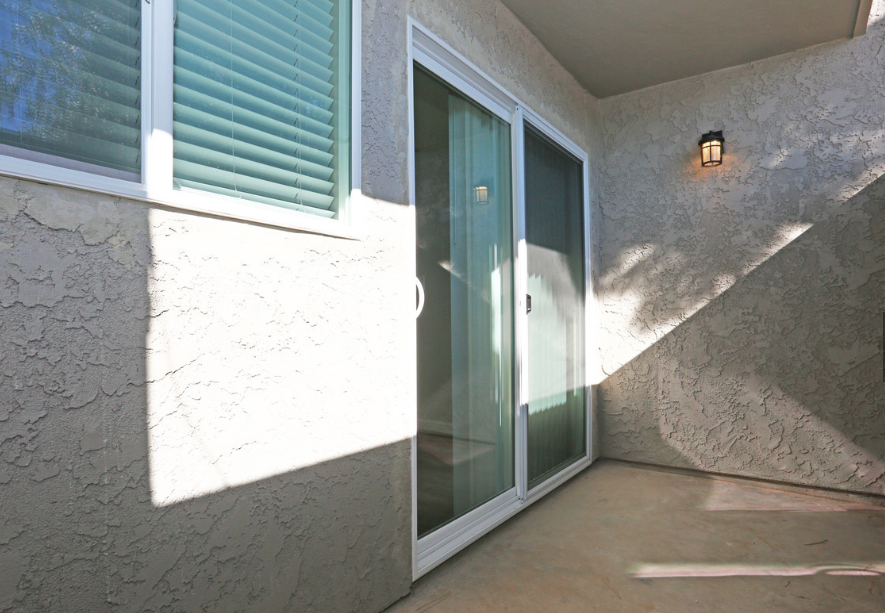the front door of a house with a glass screen door