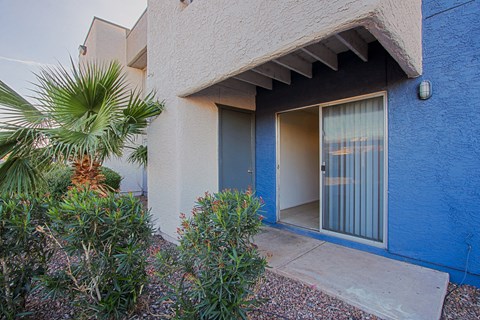 a blue and white building with a glass door