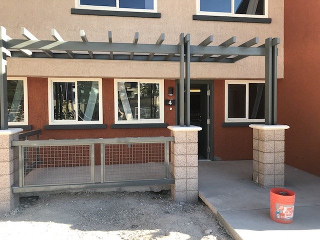 a building with a ramp and a fence in front of it