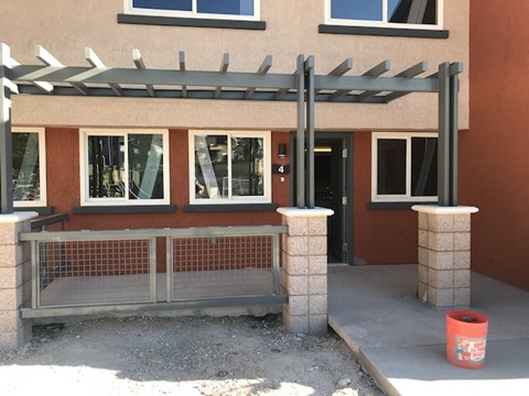 a building with a ramp and a fence in front of it