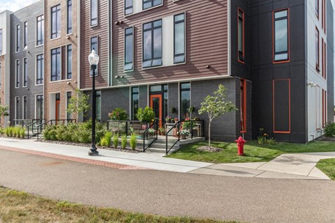a red fire hydrant in front of a building