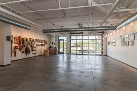 a large room with paintings on the wall and a door