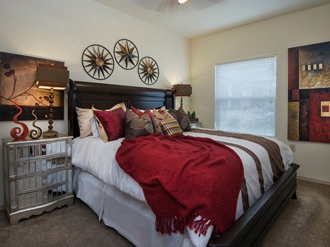 a bedroom with a bed and a window