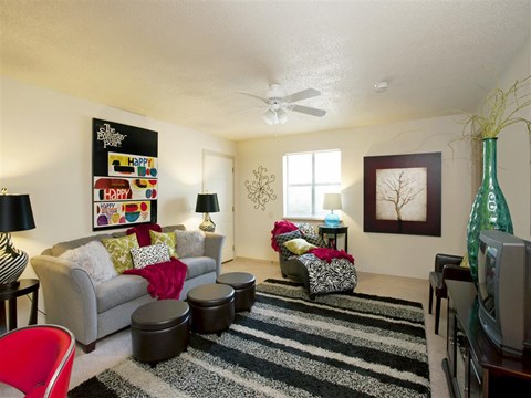 a living room with a couch and a tv