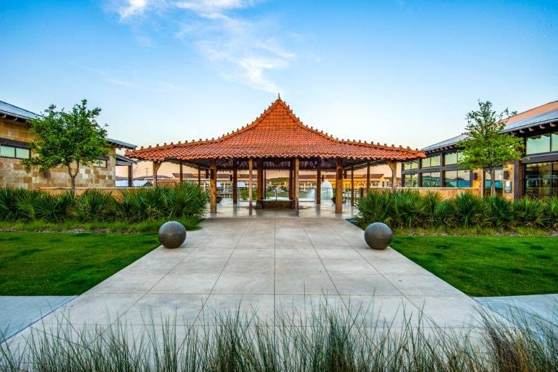 a pavilion in the middle of a courtyard