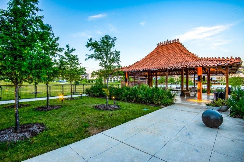 a pavilion in a park with trees