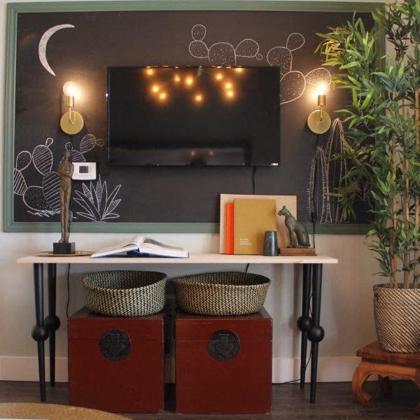 a living room with a table and a television